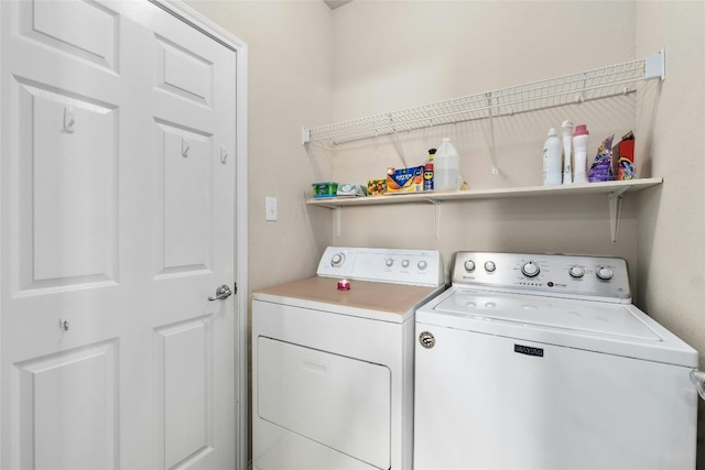 laundry area with washing machine and clothes dryer