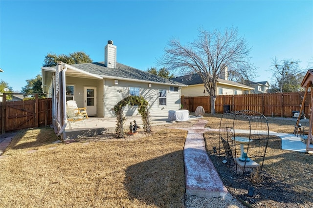 rear view of house with a patio area