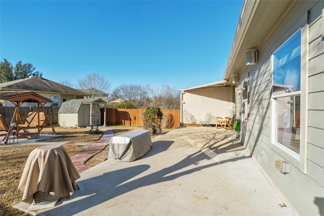 view of patio / terrace with a gazebo and a storage unit