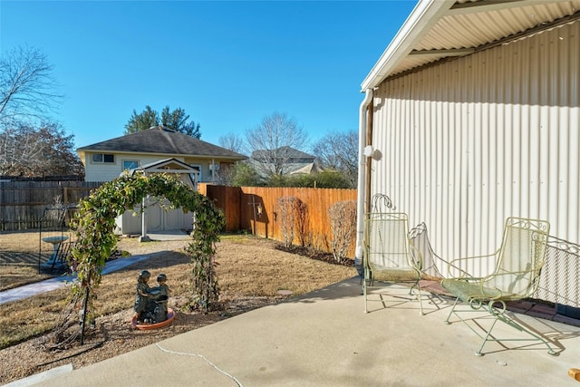 view of patio with a storage unit