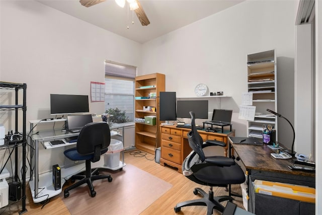 home office with hardwood / wood-style flooring and ceiling fan