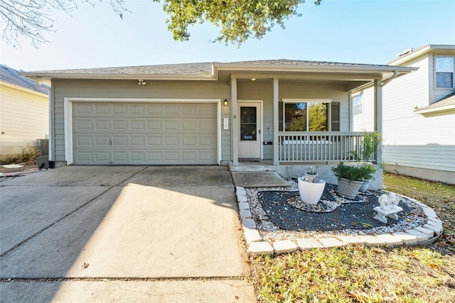 view of front of home featuring a garage and a porch