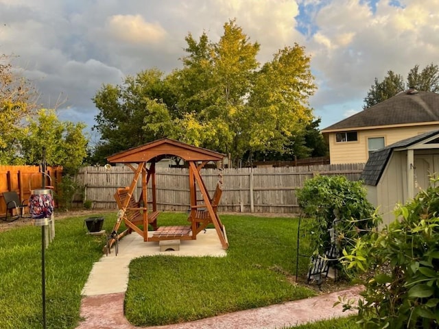 view of jungle gym featuring a patio and a lawn