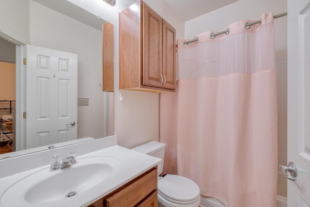 bathroom with toilet, vanity, and shower / bathtub combination with curtain