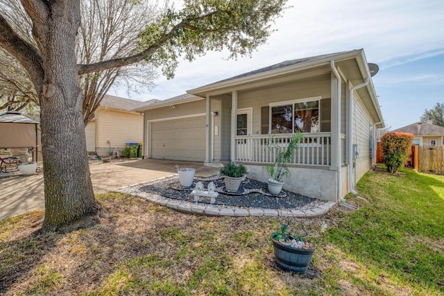 single story home with a porch, concrete driveway, fence, and a garage