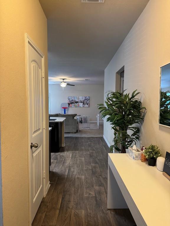 hall with dark hardwood / wood-style floors