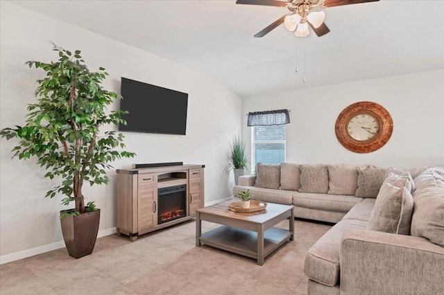 living room with ceiling fan and vaulted ceiling