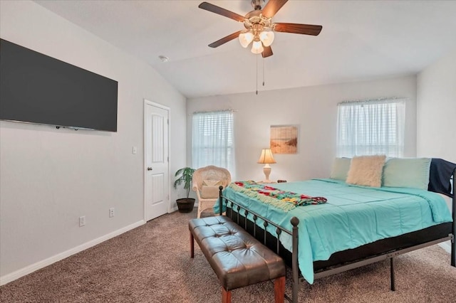 carpeted bedroom featuring multiple windows, lofted ceiling, and ceiling fan