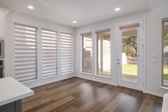 doorway with dark hardwood / wood-style floors