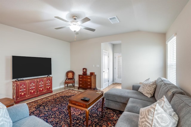 living room with lofted ceiling and ceiling fan