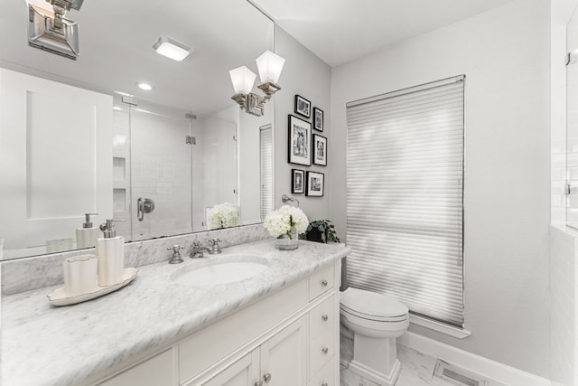 bathroom featuring walk in shower, vanity, and toilet