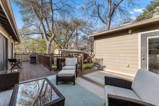 deck with area for grilling, an outdoor hangout area, and a storage unit