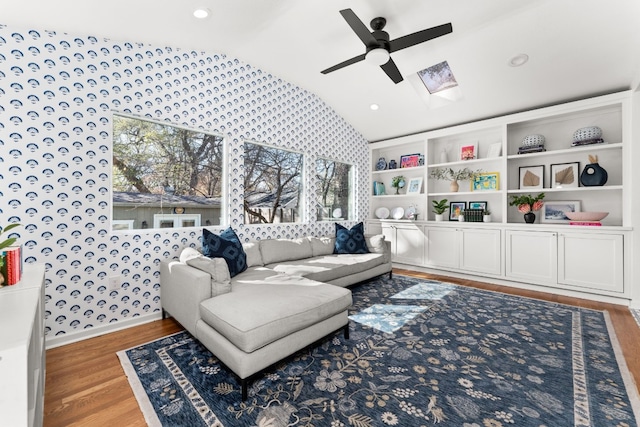 sitting room featuring ceiling fan, lofted ceiling, and hardwood / wood-style floors