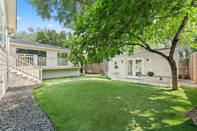 2105 Bowman Ave, Austin, TX 78703 - view of yard featuring french doors, a wooden deck, and stairs