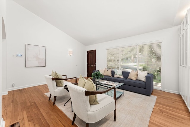 2105 Bowman Ave, Austin, TX 78703 - living room with light wood-style flooring, baseboards, and high vaulted ceiling
