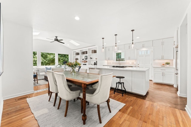 2105 Bowman Ave, Austin, TX 78703 - dining space with vaulted ceiling, recessed lighting, a ceiling fan, light wood-style floors, and baseboards