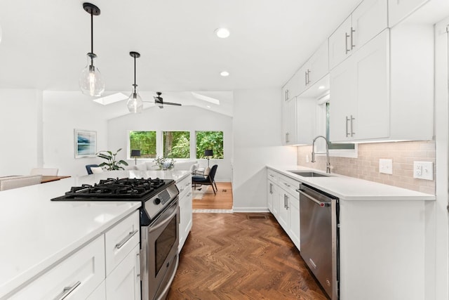 2105 Bowman Ave, Austin, TX 78703 - kitchen featuring appliances with stainless steel finishes, a sink, light countertops, ceiling fan, and recessed lighting