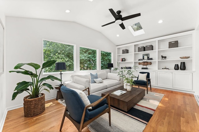2105 Bowman Ave, Austin, TX 78703 - living room featuring a skylight, ceiling fan, vaulted ceiling, light wood-style floors, and recessed lighting
