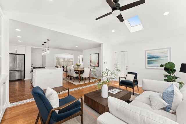 2105 Bowman Ave, Austin, TX 78703 - living room with a ceiling fan, recessed lighting, lofted ceiling, light wood finished floors, and a skylight