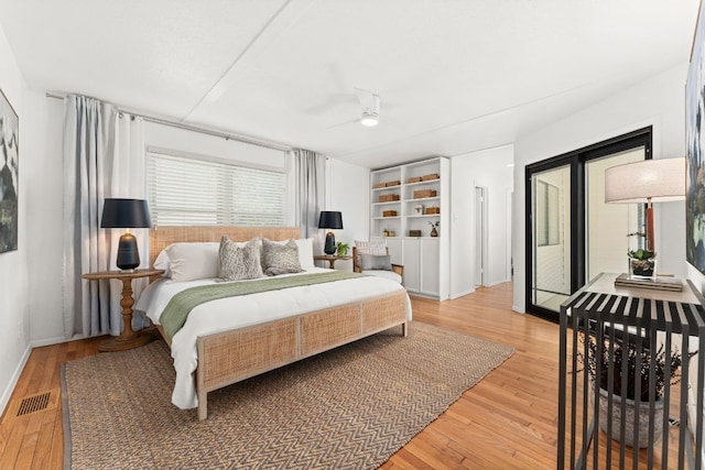 2105 Bowman Ave, Austin, TX 78703 - bedroom featuring light wood-style flooring, baseboards, and a ceiling fan
