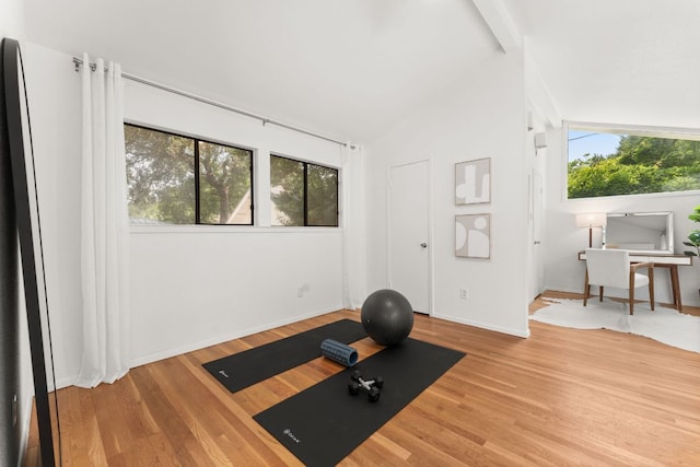 2105 Bowman Ave, Austin, TX 78703 - exercise area with wood finished floors, vaulted ceiling, and baseboards