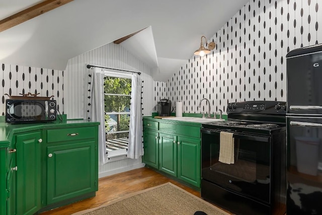 kitchen with vaulted ceiling, black electric range oven, sink, green cabinets, and light wood-type flooring