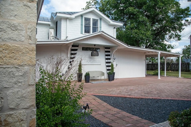 view of front of home with a carport