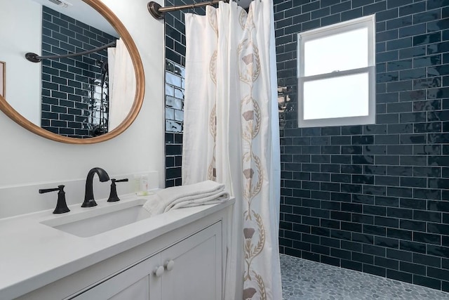 bathroom with vanity and walk in shower