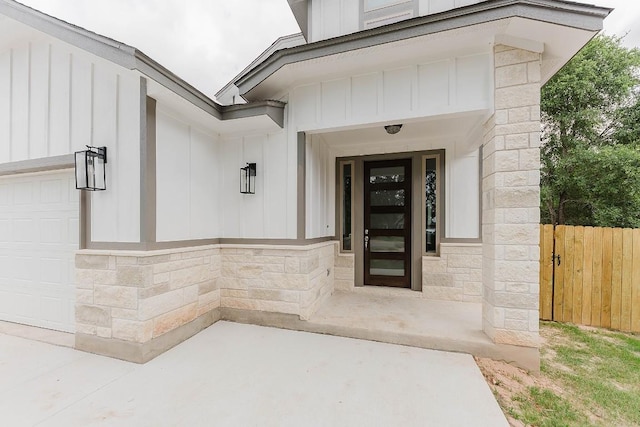 doorway to property with a garage