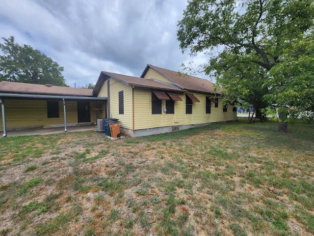 view of home's exterior with a lawn