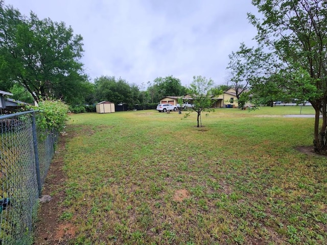 view of yard with a storage shed