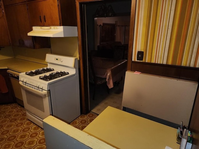 kitchen featuring dishwashing machine and white gas range oven