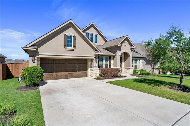 craftsman inspired home with a garage and a front yard