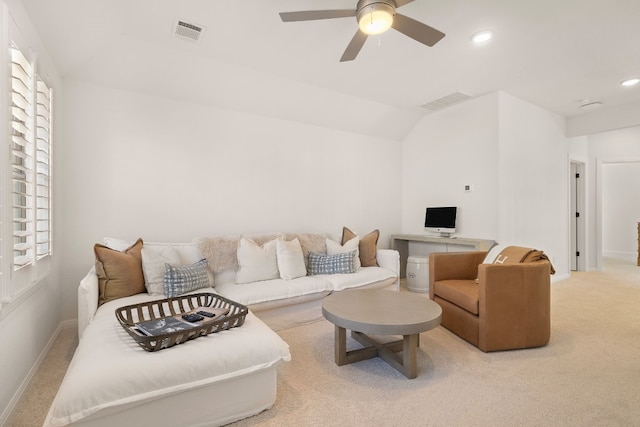 carpeted living room with vaulted ceiling and ceiling fan