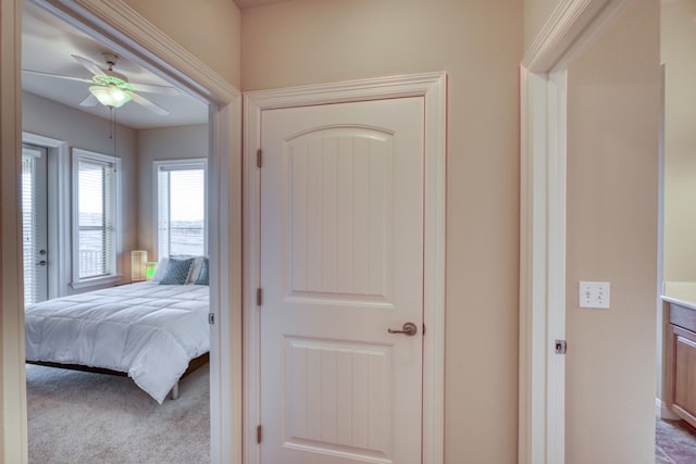 carpeted bedroom featuring ceiling fan