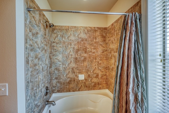 bathroom featuring shower / bath combo with shower curtain