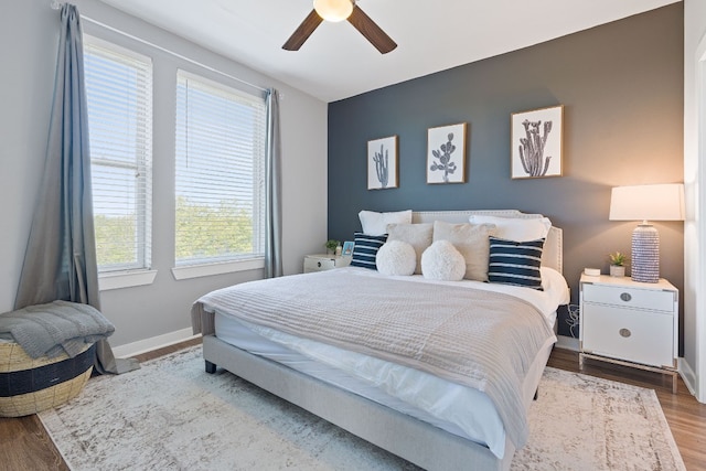 bedroom featuring hardwood / wood-style flooring and ceiling fan