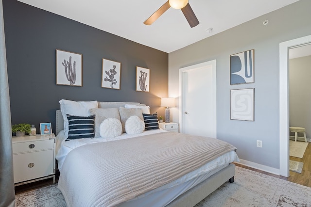 bedroom with ceiling fan and light wood-type flooring