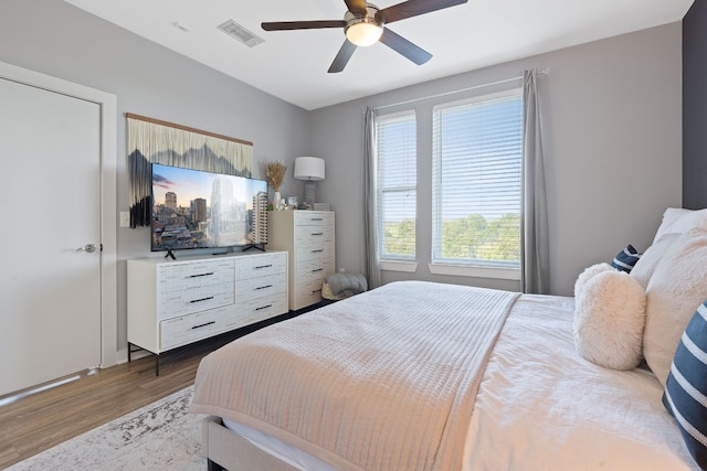 bedroom featuring hardwood / wood-style floors and ceiling fan