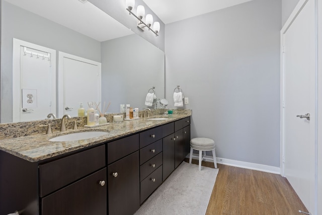 bathroom featuring vanity and hardwood / wood-style floors