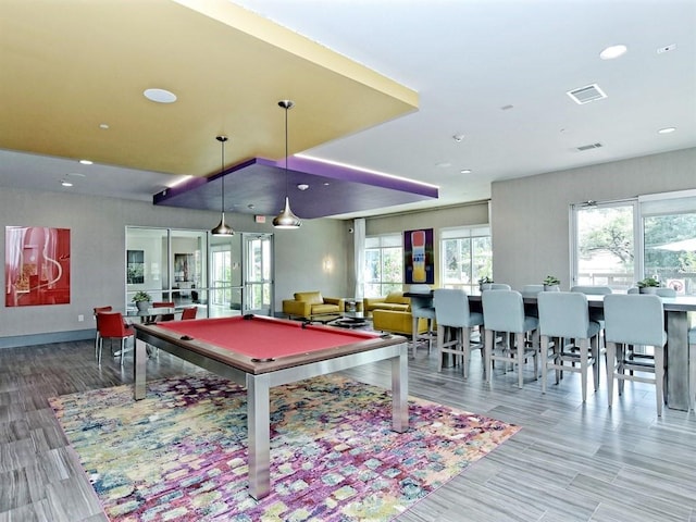 recreation room with plenty of natural light, light hardwood / wood-style flooring, and billiards