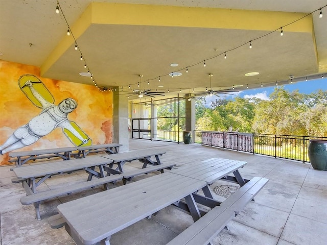 exterior space featuring ceiling fan