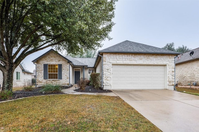 view of front of house with a garage and a front lawn