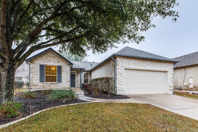 ranch-style house with a garage and a front lawn