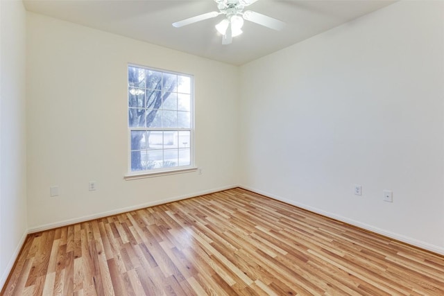 empty room with ceiling fan and light wood-type flooring