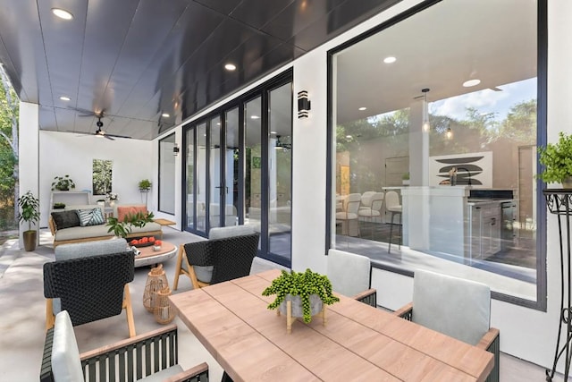 view of patio featuring ceiling fan and outdoor lounge area