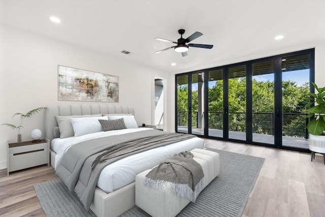 bedroom with ceiling fan, floor to ceiling windows, light hardwood / wood-style flooring, and access to outside