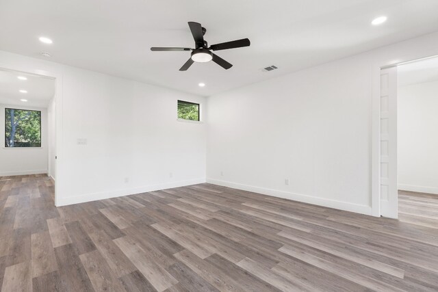 unfurnished room featuring ceiling fan and light hardwood / wood-style flooring