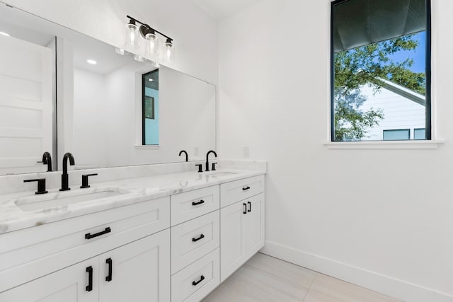 bathroom featuring tile patterned floors and vanity