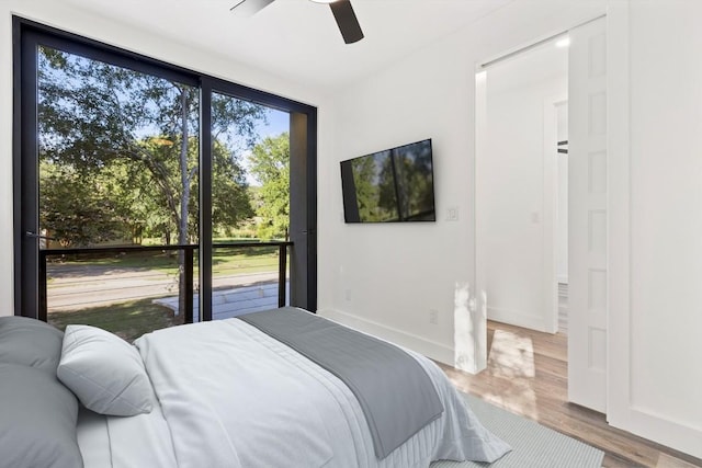 bedroom with wood-type flooring and ceiling fan